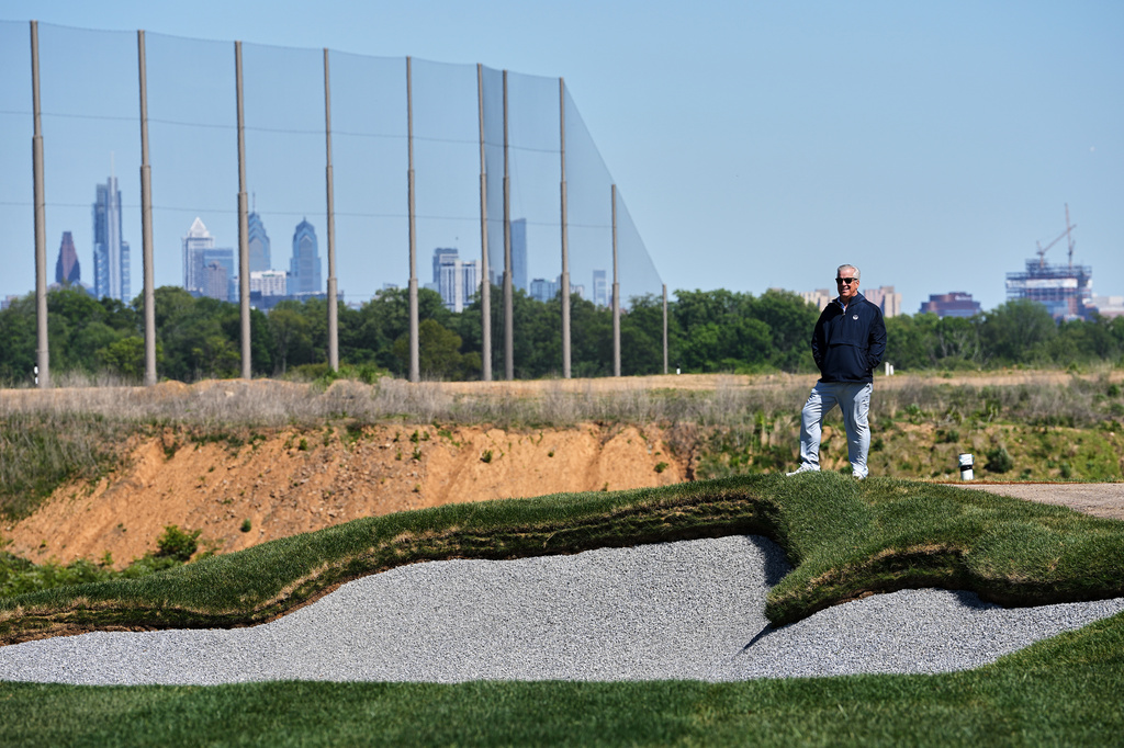 Cobbs Creek Foundation COO Enrique Hervada poses for a photograph at the Cobbs Creek Golf Club during construction in Philadelphia, Tuesday, May 12, 2026. (AP Photo/Matt Rourke)