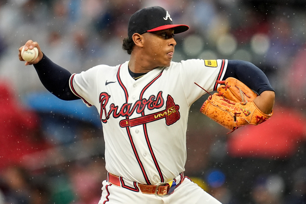Atlanta Braves pitcher Didier Fuentes works in the rain in the sixth inning of a baseball game against the Washington Nationals, Sunday, May 24, 2026, in Atlanta. (AP Photo/Mike Stewart)