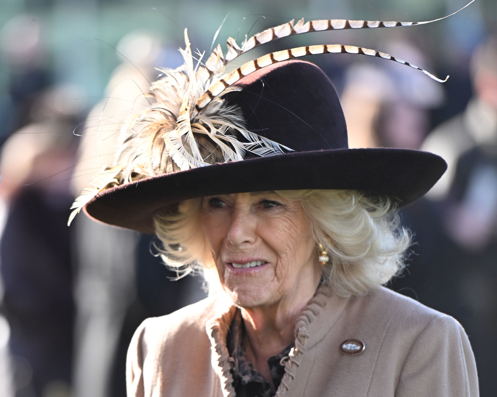 Britain's Queen Camilla attends the second day of the Cheltenham Festival at Cheltenham Racecourse, Gloucestershire, England, Wednesday, March 11, 2026. (Eddie Mulholland/Pool Photo via AP)
