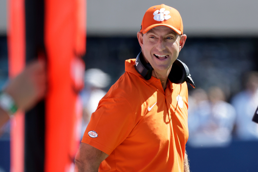 Clemson head coach Dabo Swinney flashes a smile during the first half of an NCAA college football game against North Carolina, Saturday, Oct. 4, 2025, in Chapel Hill, N.C. (AP Photo/Chris Seward)