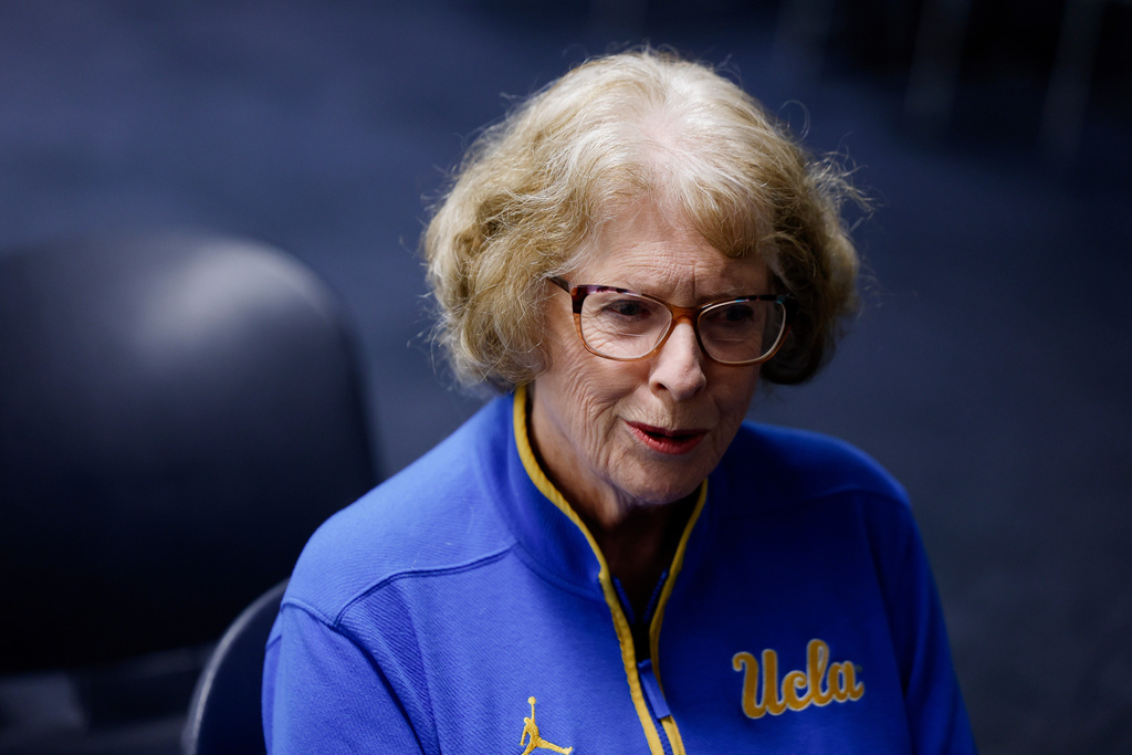 Patti Close, mother of UCLA head coach Cori Close, speaks with a reporter ahead of an NCAA college basketball game against Rutgers, Wednesday, Feb. 4, 2026, in Los Angeles. (AP Photo/Caroline Brehman)
