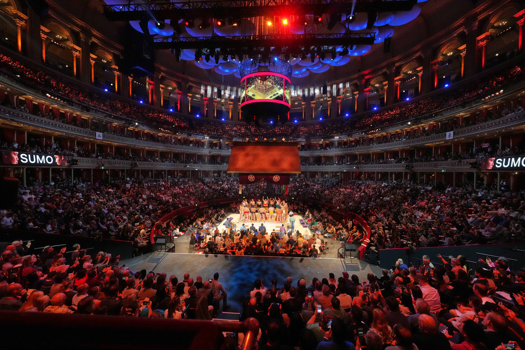 The opening ceremony ahead of the Grand Sumo Tournament on the dohyo, the sacred sumo wrestling ring, at the Royal Albert Hall in London, Sunday, Oct. 19, 2025.(AP Photo/Frank Augstein)
