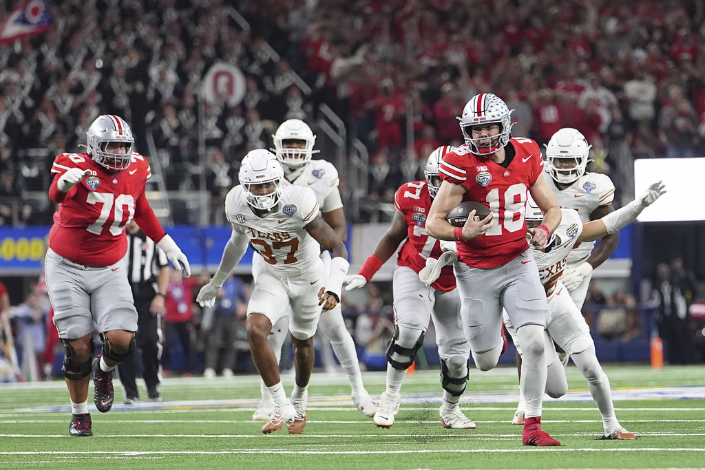 FILE - Ohio State quarterback Will Howard (18) runs against Texas during the second half of the Cotton Bowl College Football Playoff semifinal game, Jan. 10, 2025, in Arlington, Texas. (AP Photo/Julio Cortez, File)