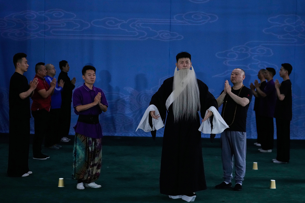 Peking Opera actors rehearse a newly written play at the Jingju Theatre Company in Beijing, China, Friday, Sept. 5, 2025. (AP Photo/Mahesh Kumar A.)