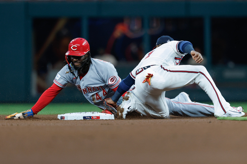 Cincinnati Reds' Elly De La Cruz (44) steals second base against Atlanta Braves second baseman Ozzie Albies (1) during the first inning of a baseball game, Tuesday, Sept. 22, 2026, in Atlanta. (AP Photo/Erik S. Lesser)
