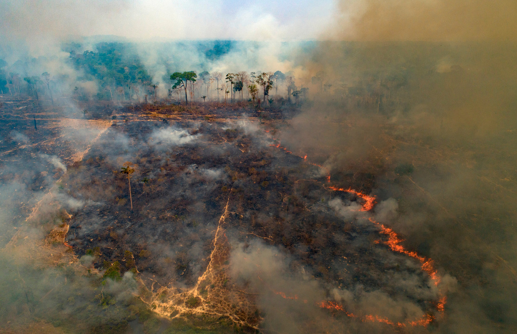 FILE - A wildfire consumes land recently deforested by cattle farmers near Novo Progresso, Para state, Brazil, Aug. 23, 2020. (AP Photo/Andre Penner, File)