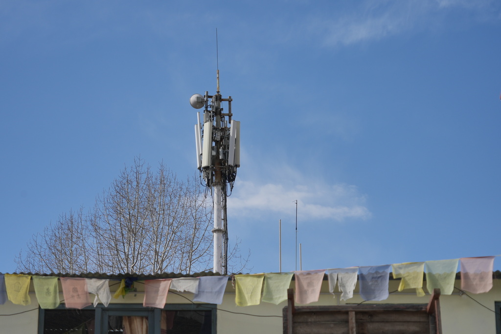 A Nepal Telecom cell tower wired with Chinese equipment stands near Sree Muktinath temple in the remote Himalayan town of Ranipauwa, Nepal, April 16, 2025. (AP Photo/Dake Kang)