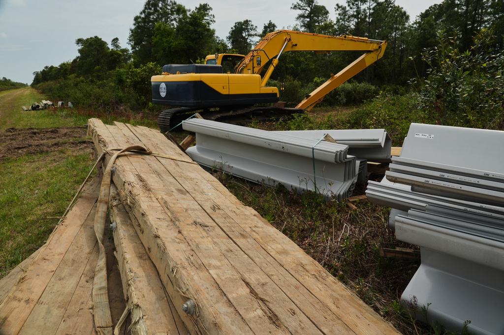 Construction materials sit near a peatland restoration site Wednesday, May 6, 2026, in Belhaven, N.C. (AP Photo/Joshua A. Bickel)