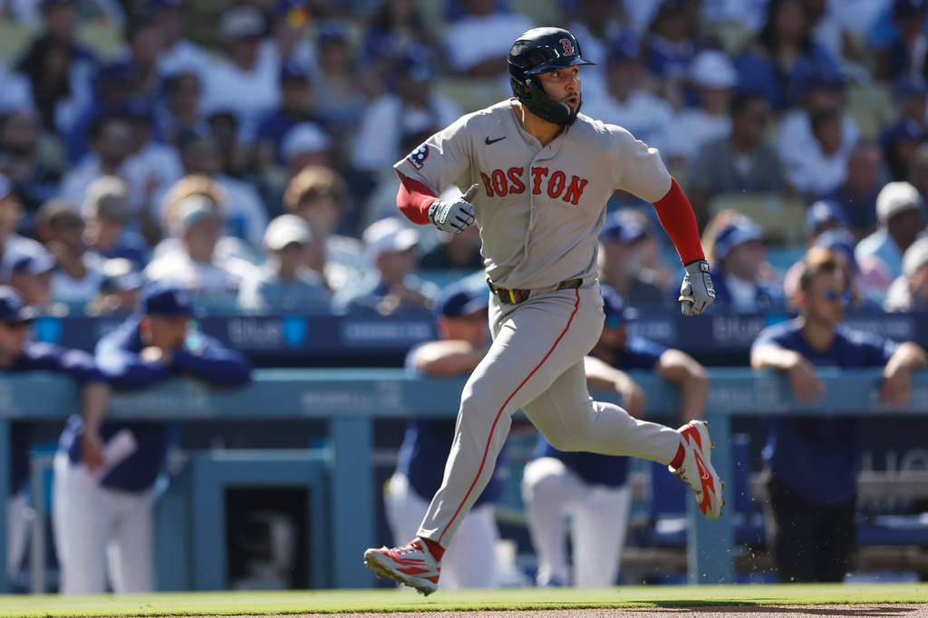 Boston Red Sox's Wilyer Abreu (52) runs home to score on a single hit by Boston Red Sox's Caleb Durbin during the first inning of a baseball game against the Los Angeles Dodgers, Sunday, Aug. 2, 2026, in Los Angeles. (AP Photo/Caroline Brehman)