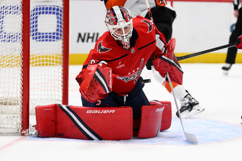 Washington Capitals goaltender Logan Thompson (48) stops the puck during the second period of an NHL hockey game against the Philadelphia Flyers, Tuesday, March 31, 2026, in Washington. (AP Photo/Nick Wass)