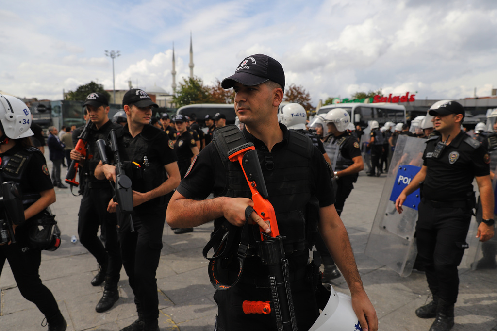Turkish police stand guard outside a courthouse after preventing LGBTQ+ rights supporters from holding a news conference in Istanbul, Turkey, Tuesday, Sept. 15, 2026. (AP Photo/Dilara Acikgoz)