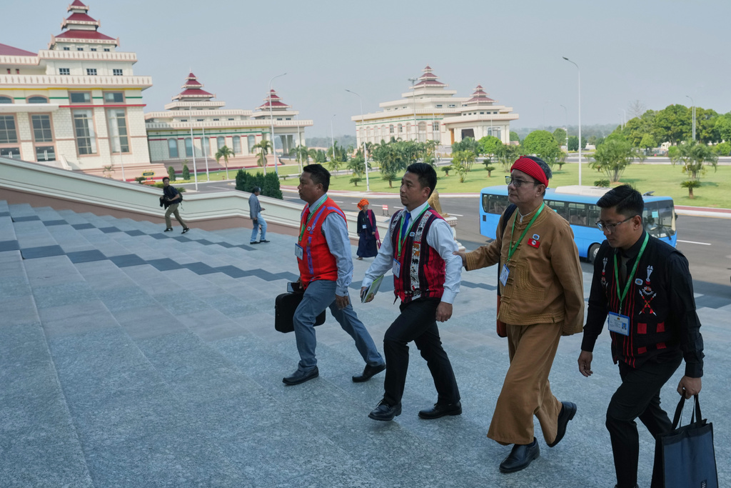 CORRECTS THE YEAR - Myanmar lawmakers arrive to attend a session at Lower House parliament in Naypyitaw, Myanmar, Monday, March 16, 2026. (AP Photo/Aung Shine Oo)
