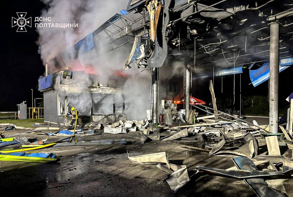 In this photo provided by the Ukrainian Emergency Services on Monday, June 29, 2026, a rescue worker puts out a fire of petrol station damaged by a Russian strike on Poltava region, Ukraine. (Ukrainian Emergency Service via AP)