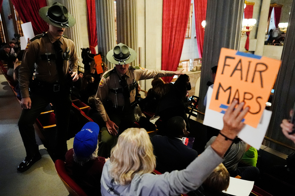 State troopers remove people from the House gallery during a special session of the state legislature to redraw U.S. Congressional voting maps Thursday, May 7, 2026, in Nashville, Tenn. (AP Photo/George Walker IV)