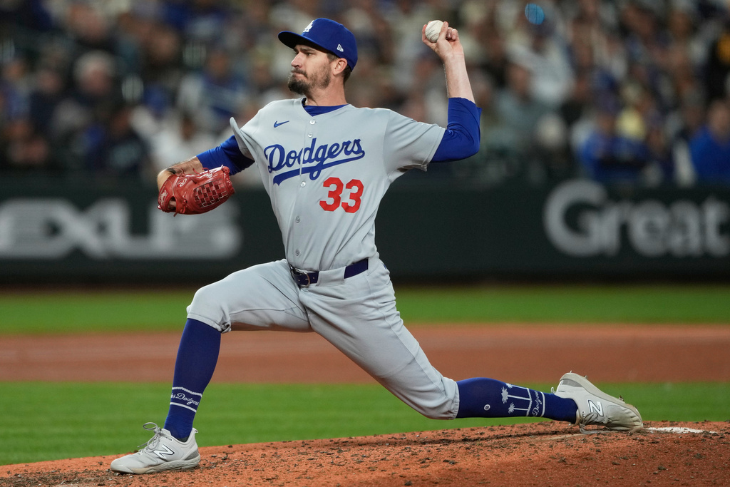 Los Angeles Dodgers relief pitcher Andrew Heaney throws during the fifth inning of a baseball game against the Seattle Mariners, Saturday, Sept. 27, 2025, in Seattle. (AP Photo/Ryan Sun)