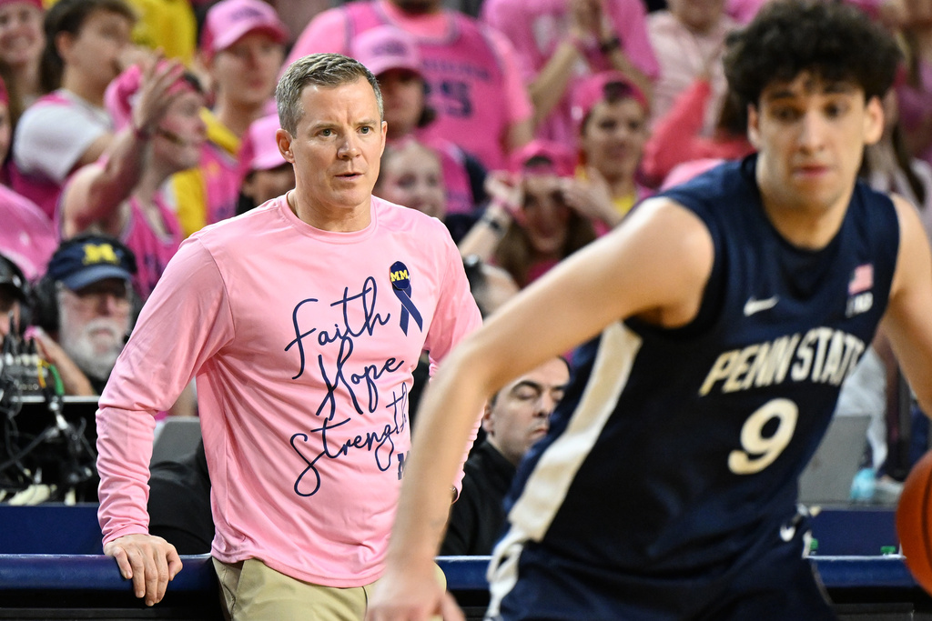 Michigan head coach Dusty May watches from the bench as his team plays Penn State in the first half of an NCAA college basketball game in Ann Arbor, Mich., Thursday, Feb. 5, 2026. (AP Photo/Lon Horwedel)