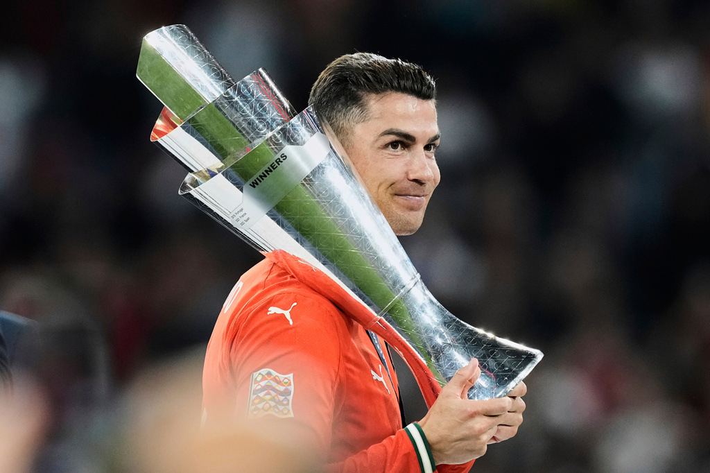 FILE - Portugal's Cristiano Ronaldo holds the trophy after winning the Nations League soccer championship at the Allianz Arena in Munich, Germany, Sunday, June 8, 2025. (AP Photo/Martin Meissner, File)