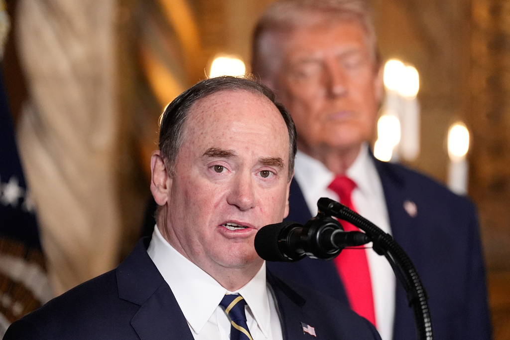 FILE - Secretary of the Navy John Phelan speaks, as President Donald Trump listens, at Trump's Mar-a-Lago club, Dec. 22, 2025, in Palm Beach, Fla. (AP Photo/Alex Brandon, file)