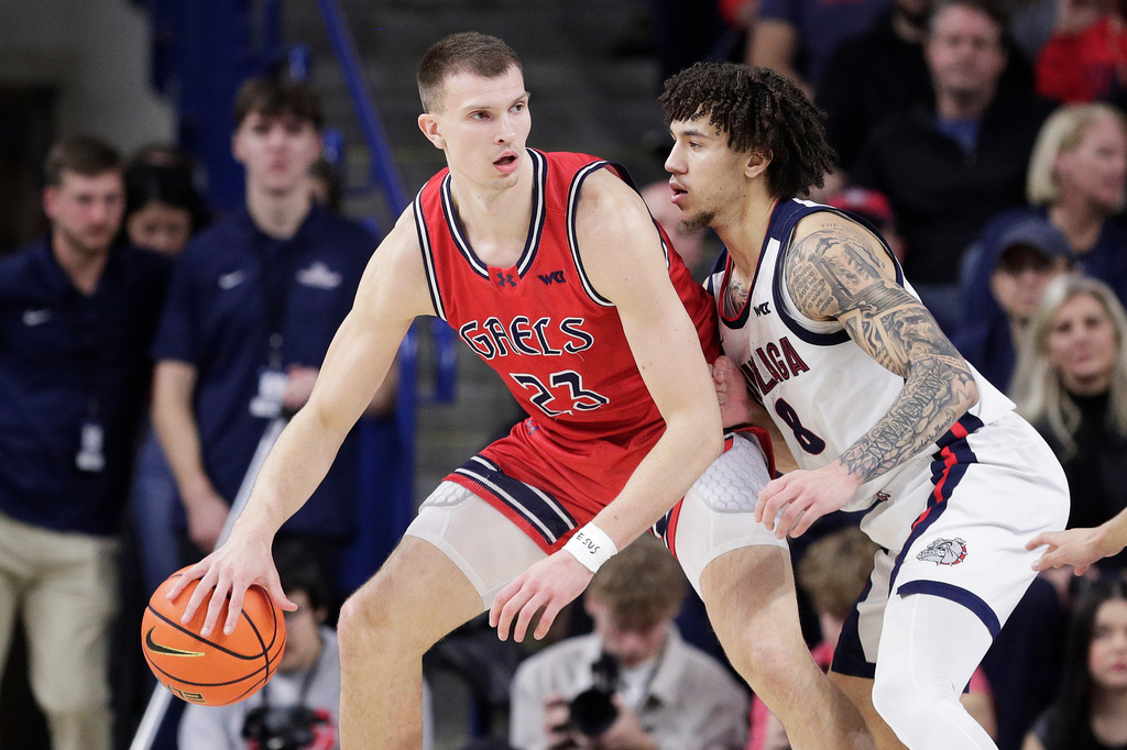 FILE - Saint Mary's forward Paulius Murauskas (23) controls the ball while pressured by Gonzaga guard Jalen Warley (8) during the first half of an NCAA college basketball game, Jan. 31, 2026, in Spokane, Wash. (AP Photo/Young Kwak, File)