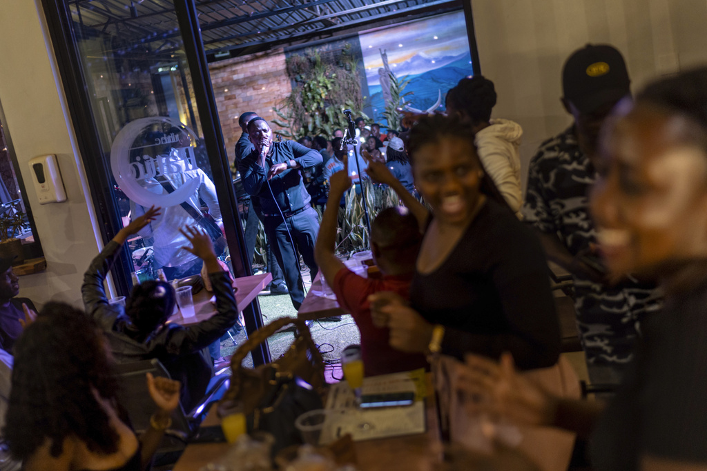 Patrons dance as a band performs at a night club, Saturday, Nov. 23, 2024, in Kampala, Uganda, where about three-fourths of Uganda's 43 million people are under 35, to according to UNICEF. (AP Photo/David Goldman)