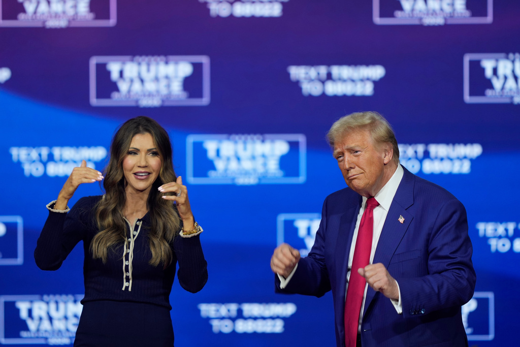 FILE - Republican presidential nominee former President Donald Trump and South Dakota Gov. Kristi Noem dance to the song "Y.M.C.A." at a campaign town hall at the Greater Philadelphia Expo Center & Fairgrounds, Oct. 14, 2024, in Oaks, Pa. (AP Photo/Matt Rourke, File)