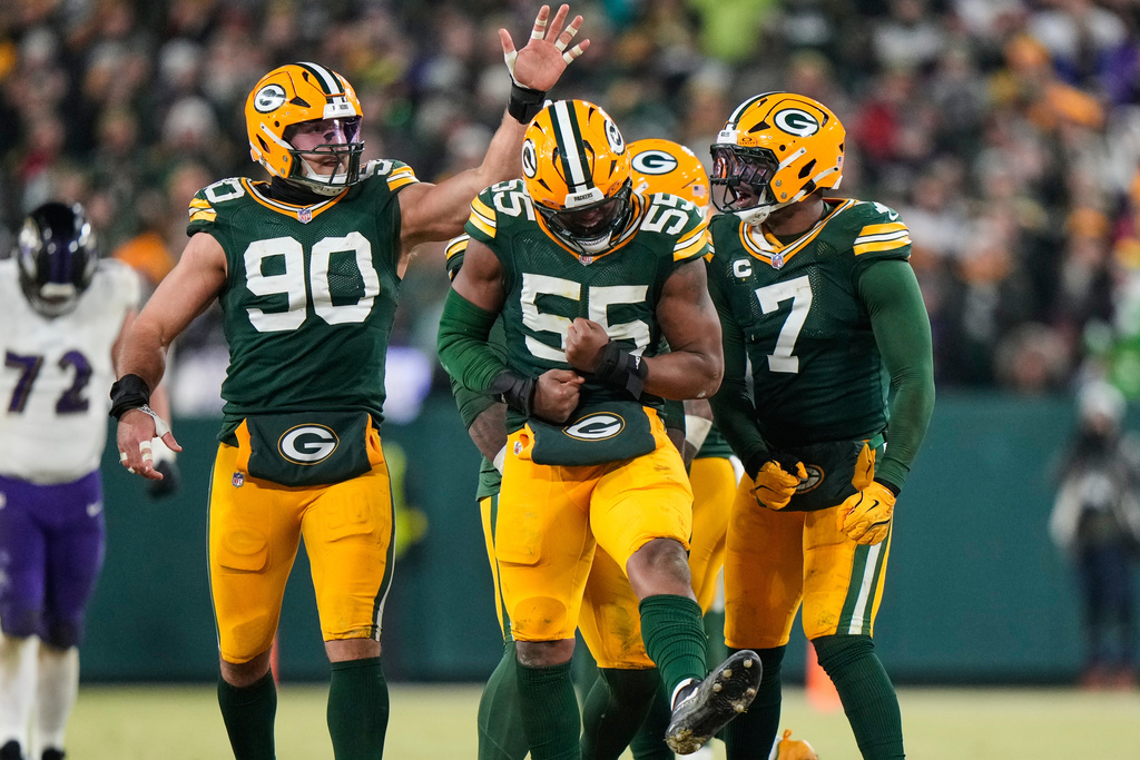 Green Bay Packers defensive end Kingsley Enagbare (55) celebrates after making a stop against Baltimore Ravens running back Derrick Henry during the second half of an NFL football game, Saturday, Dec. 27, 2025, in Green Bay, Wis. (AP Photo/Morry Gash)