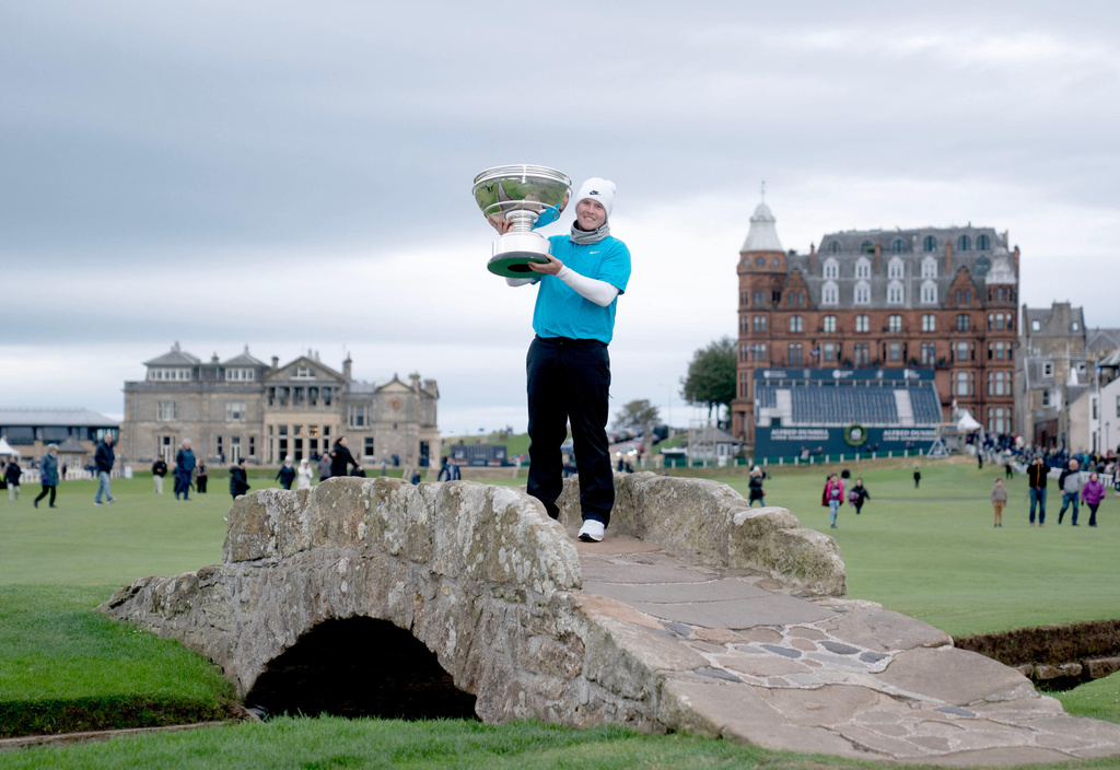 Scotland's Robert McIntyre poses with the trophy after winning the 2025 Alfred Dunhill Links Championship at the Old Course, St Andrews, Scotland, Sunday, Oct. 5, 2025. (Jane Barlow/PA via AP)