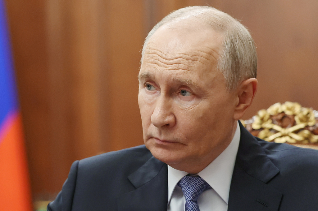 Russian President Vladimir Putin speaks with Sergei Menyailo, the North Ossetia-Alania Republic Head, during their meeting at the Kremlin in Moscow, Tuesday, June 16, 2026. (Vyacheslav Prokofyev, Sputnik, Kremlin Pool Photo via AP)