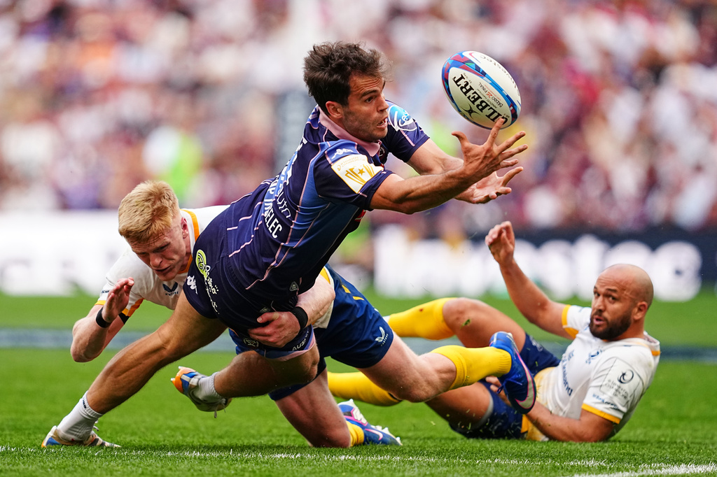 Bordeaux's Damian Penaud is tackled by Leinster's Tommy O'Brien during the European Champions Cup final rugby union match between Leinster and Bordeaux in Bilbao, Spain, Saturday, May 23, 2026. (AP Photo/Miguel Oses)