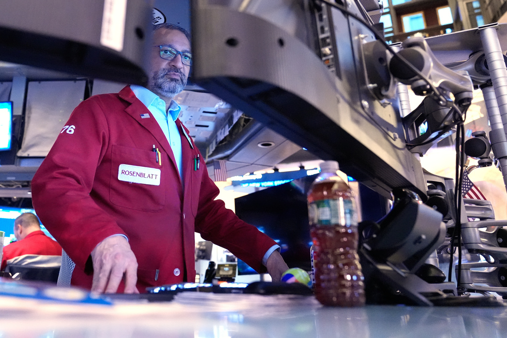 Aman Patel works on the floor at the New York Stock Exchange in New York, Friday, Jan. 9, 2026. (AP Photo/Seth Wenig)