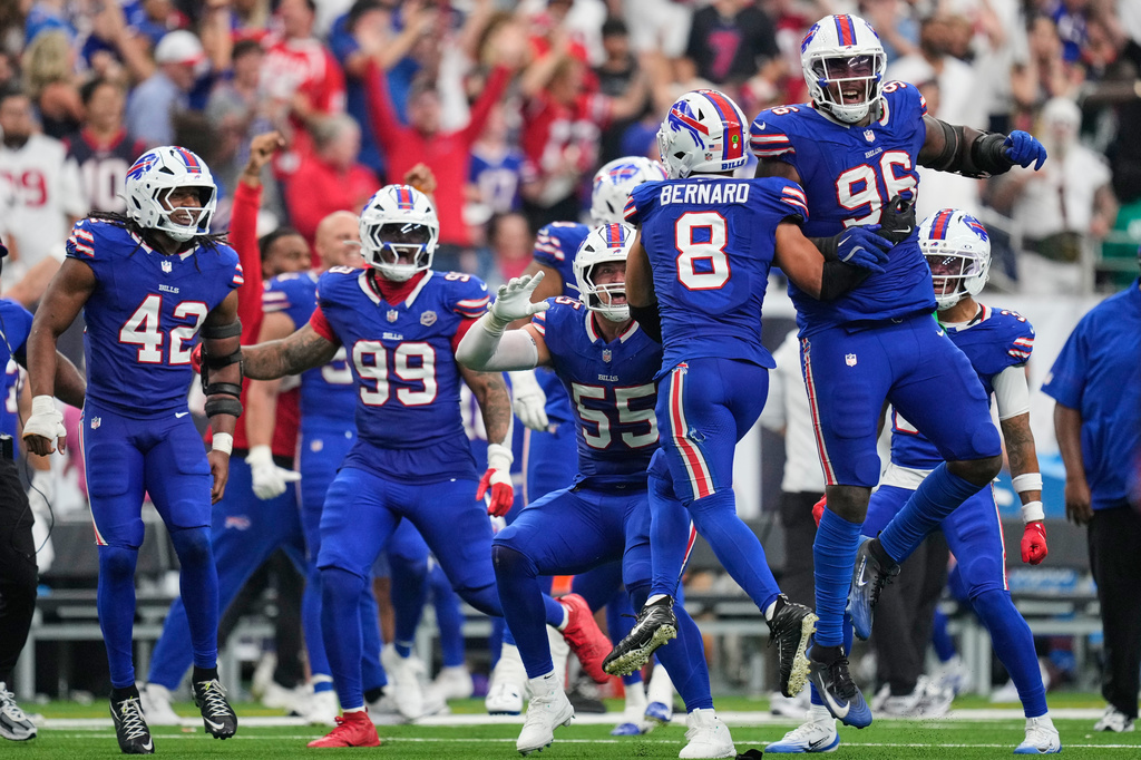 Buffalo Bills linebacker Terrel Bernard (8) celebrates with teammates after recovering a fumble against the Houston Texans during the second half of an NFL football game, Sunday, Sept. 13, 2026, in Houston. (AP Photo/Ashley Landis)