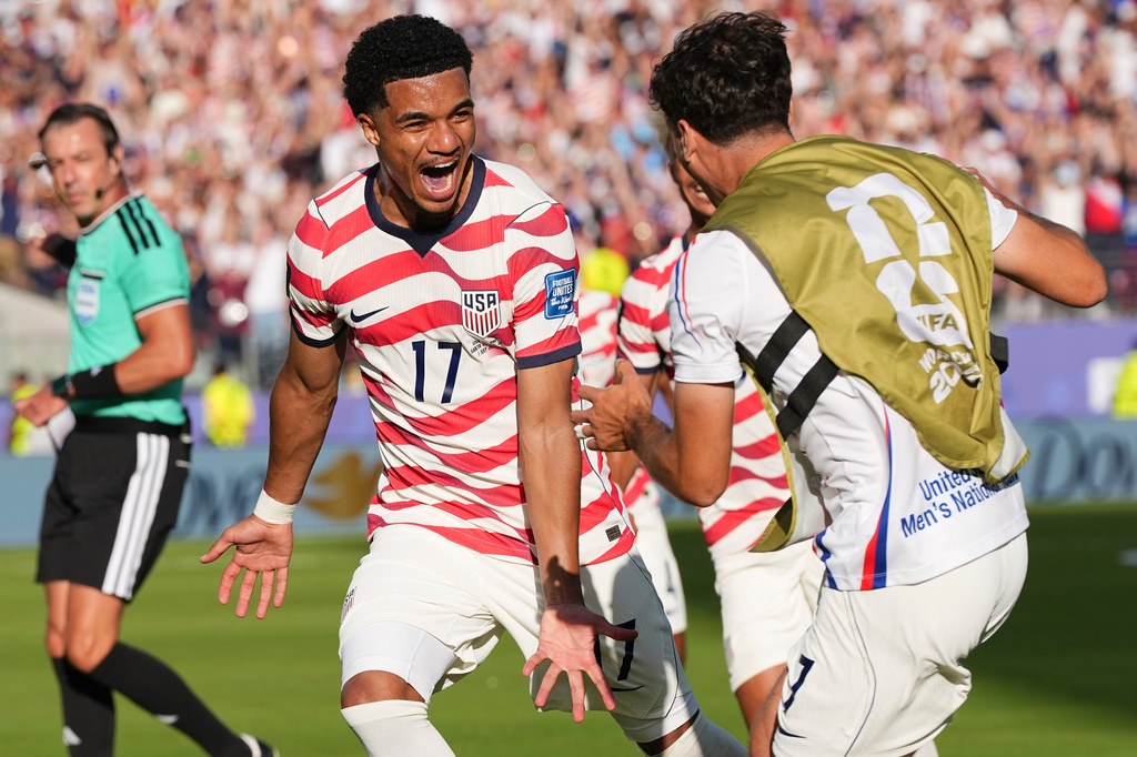 United States' Malik Tillman (17) celebrates with United States' Giovanni Reyna (7) after scoring on a free kick during the World Cup round of 32 soccer match between the United States and Bosnia in Santa Clara, Calif., near San Francisco, Wednesday, July 1, 2026. (AP Photo/Martin Meissner)