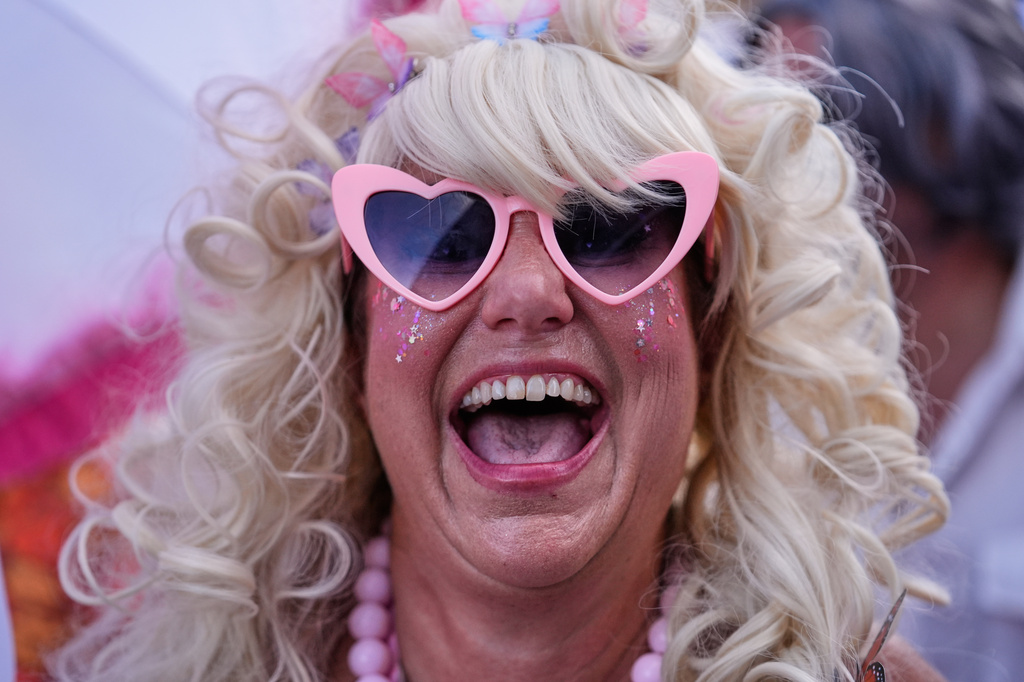 Members of the Krewe of Dolly lead a second line parade in commemoration of the life of Dolly Parton through the French Quarter Friday, Sept. 25, 2026, in New Orleans. (AP Photo/Gerald Herbert)