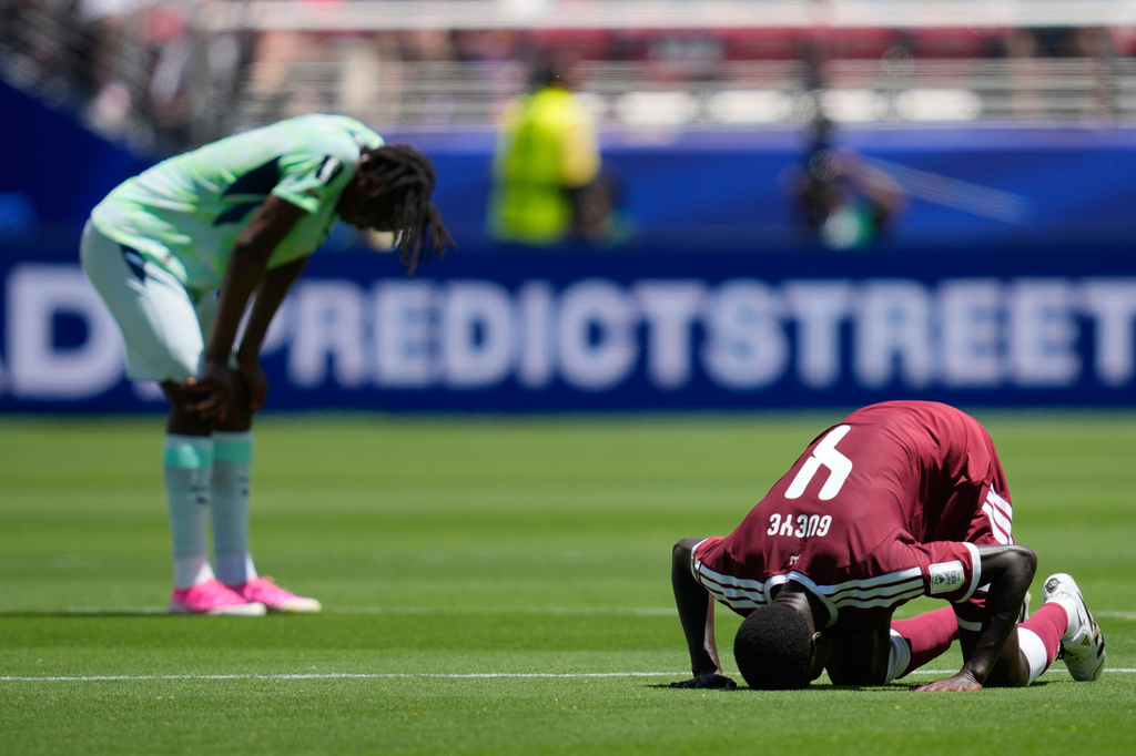 FILE - Qatar's Issa Laye prays after the World Cup Group B soccer match between Qatar and Switzerland in Santa Clara, Calif., June 13, 2026. (AP Photo/Eugene Hoshiko, File)