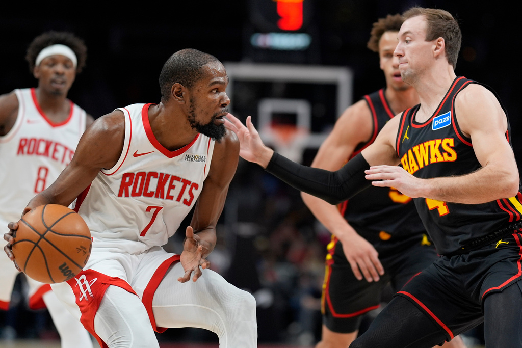 Houston Rockets forward Kevin Durant (7) drives against Atlanta Hawks guard Luke Kennard (4) during the first half of an NBA basketball game, Thursday, Jan. 29, 2026, in Atlanta. (AP Photo/Mike Stewart)