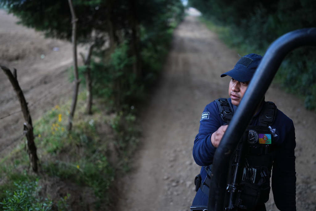 Community police patrol the autonomous Indigenous community of Sevina, Mexico, Saturday, Nov. 22, 2025. (AP Photo/Eduardo Verdugo)