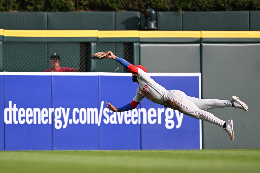 Philadelphia Phillies center fielder Derek Hill makes a leaping catch to take away a hit from the Detroit Tigers in the third inning of a baseball game, Saturday, July 11, 2026, in Detroit. (AP Photo/Lon Horwedel)