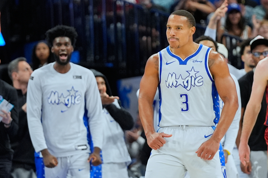 Orlando Magic guard Desmond Bane (3) reacts after sinking a 3-point shot against the Cleveland Cavaliers during the second half of an NBA basketball game, Wednesday, March 11, 2026, in Orlando, Fla. (AP Photo/John Raoux)