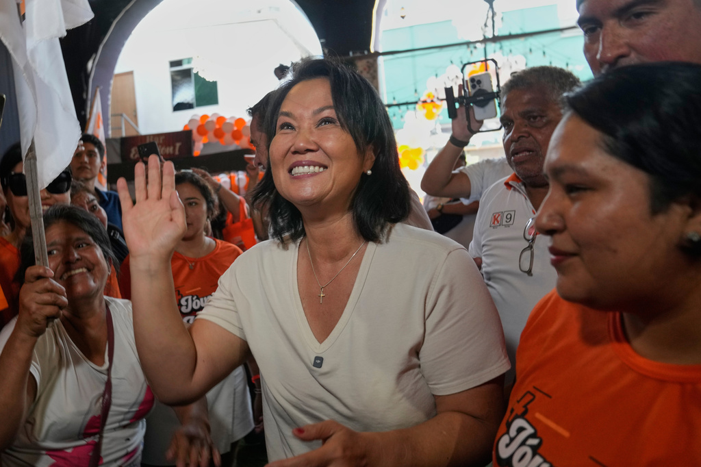 Presidential candidate Keiko Fujimori, of the Popular Force party, waves to supporters during a campaign rally in the San Juan de Lurigancho neighborhood of Lima, Peru, Thursday, April 2, 2026. (AP Photo/Martin Mejia)