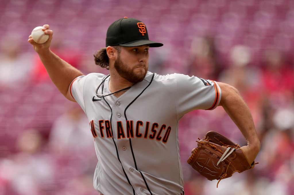 San Francisco Giants pitcher Landen Roupp throws during the first inning of a baseball game against the Cincinnati Reds in Cincinnati, Thursday, April 16, 2026. (AP Photo/Carolyn Kaster)