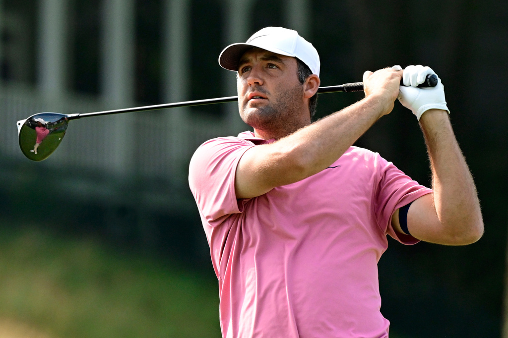 Scottie Scheffler tees off the first playoff hole of the Travelers Championship golf tournament at TPC River Highlands, Monday, June 29, 2026, in Cromwell, Conn. (AP Photo/Jessica Hill)