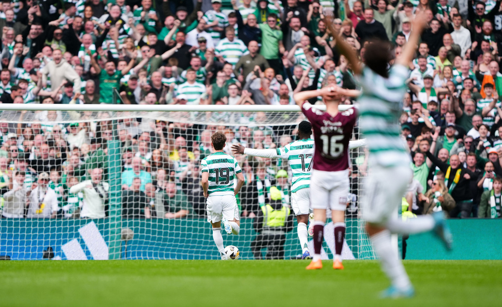 Celtic's Callum Osmand runs clean through to score his side's third goal during the Premiership soccer match between Celtic and Heart of Midlothian, in Glasgow, Scotland, Saturday May 16, 2026. (Andrew Milligan/PA via AP)