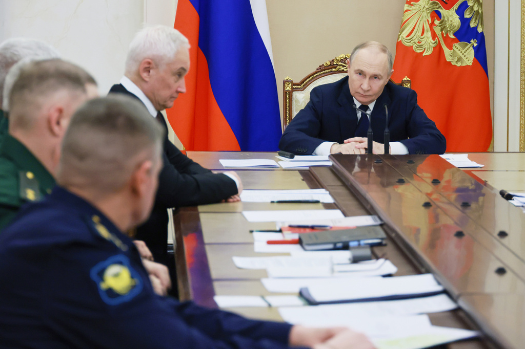 FILE - Russian President Vladimir Putin, right, attends a meeting with senior military officers as Russian Defense Minister Andrei Belousov, fourth left, sits near at the Kremlin in Moscow, Russia, Dec. 29, 2025. (Mikhail Metzel/Sputnik, Kremlin Pool Photo via AP, File)