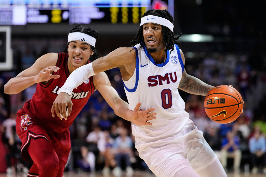 SMU guard B.J. Edwards (0) drives to the basket as Louisville's Mikel Brown Jr., left, defends in the second half of an NCAA college basketball game in Dallas, Tuesday, Feb. 17, 2026. (AP Photo/Tony Gutierrez)