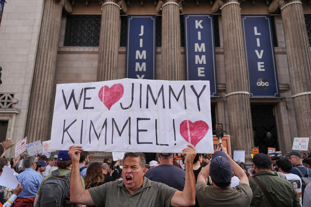 FILE - Oscar Villanueva holds a sign in support of talk show host Jimmy Kimmel outside El Capitan Entertainment Centre, where his late-night show is staged, in Los Angeles, Sept. 18, 2025. (AP Photo/Jae C. Hong, File)