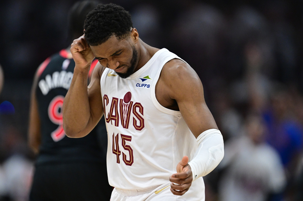 Cleveland Cavaliers guard Donovan Mitchell reacts after making a three point basket during the first half in Game 5 of a first-round NBA playoffs basketball series against the Toronto Raptors, Wednesday, April 29, 2026, In Cleveland. (AP Photo/David Dermer)
