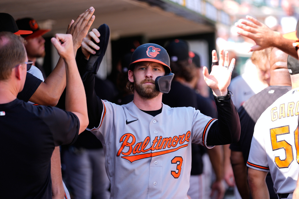 Baltimore Orioles' Taylor Ward (3) celebrates scoring against the Detroit Tigers during the 12th inning of a baseball game Wednesday, July 29, 2026, in Detroit. (AP Photo/Paul Sancya)