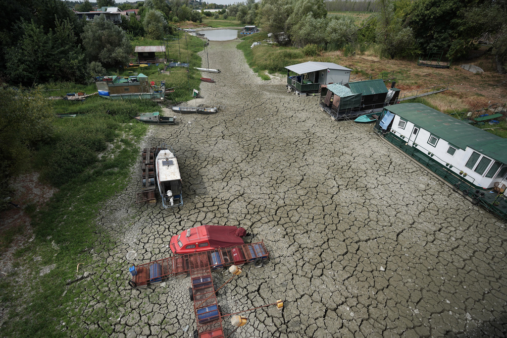 FILE - Boats sit on dry ground as water levels have dropped on the Danube River in Petrovaradin, Serbia, Aug. 25, 2026. (AP Photo/Darko Vojinovic, File)
