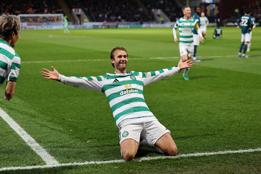 Celtic's Benjamin Nygren celebrates scoring their side's second goal during the Scottish Premiership soccer match between Motherwell and Celtic, Wednesday, May 13, 2026, in Motherwell, Scotland. (Robert Perry/PA via AP)