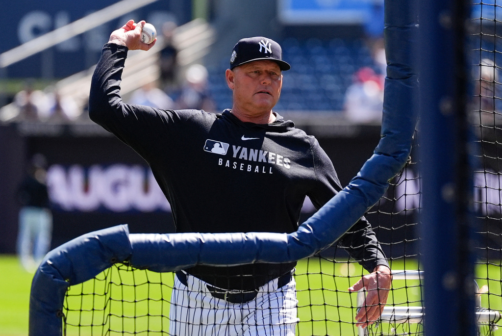 FILE - Former New York Yankees' Roger Clemens (22) throws ahead of the Yankees Old-Timers' Day ceremony before a baseball game against the Houston Astros, Saturday, Aug. 9, 2025, in New York. (AP Photo/Yuki Iwamura, file)